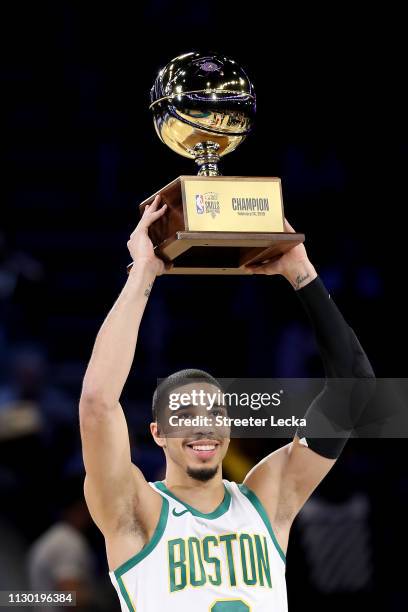 Jayson Tatum of the Boston Celtics celebrates with the trophy after winning the Taco Bell Skills Challenge as part of the 2019 NBA All-Star Weekend...