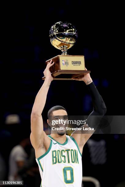 Jayson Tatum of the Boston Celtics celebrates with the trophy after winning the Taco Bell Skills Challenge as part of the 2019 NBA All-Star Weekend...