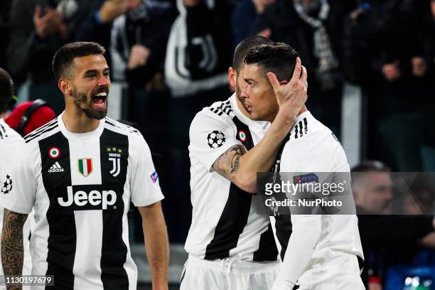Cristiano Ronaldo celebrates with teammates after scoring his second goal during the UEFA Champions League round of 16 second leg match between Club...