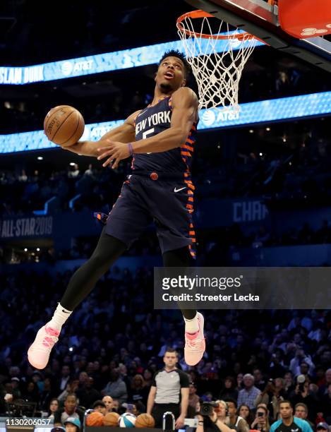 Dennis Smith, Jr. #5 of the New York Knicks attempts a dunk during the AT&T Slam Dunk as part of the 2019 NBA All-Star Weekend at Spectrum Center on...