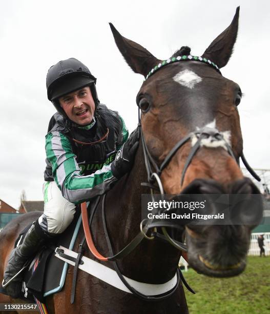 Cheltenham , United Kingdom - 13 March 2019; Nico de Boinville celebrates on Altior after winning the Betway Queen Mother Champion Chase on Day Two...