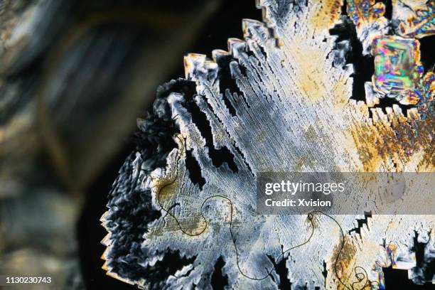 ferrous sulfate crystalization under polarized light - crystalization stock pictures, royalty-free photos & images