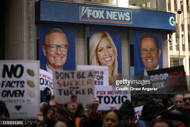 Protesters rally against Fox News outside the Fox News headquarters at the News Corporation building, March 13, 2019 in New York City. On Wednesday...