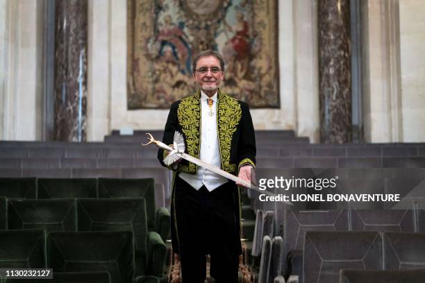 Czech former dancer and choreographer Jiri Kylian, poses with his sword after being elected as foreign associate member of the Academy of Fine Arts ,...