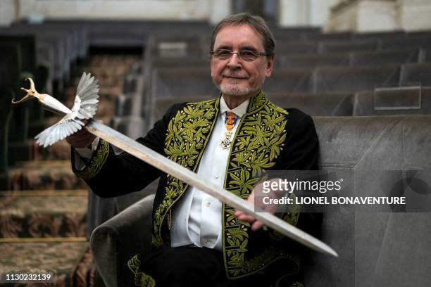 Czech former dancer and choreographer Jiri Kylian, poses with his sword after being elected as foreign associate member of the Academy of Fine Arts ,...