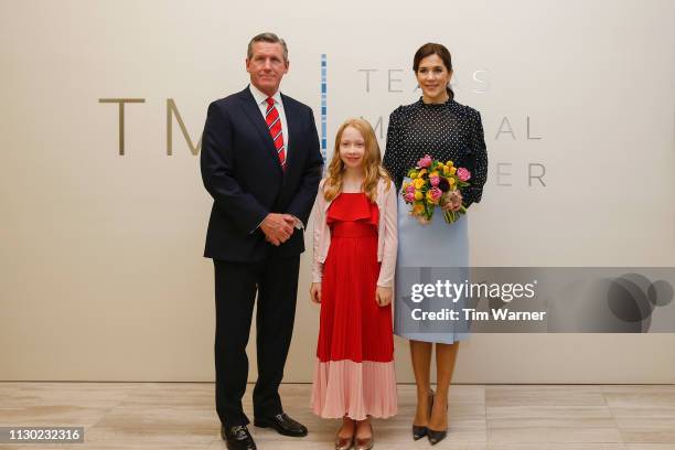 Her Royal Highness Crown Princess Mary of Denmark receives flowers from a flower girl before an event highlighting an exploration of life science...