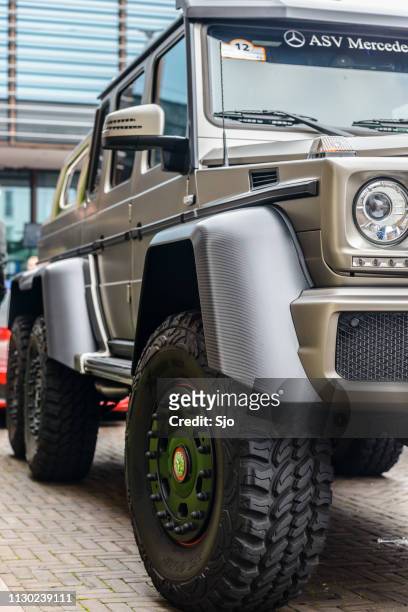 mercedes-benz g 63 amg 6x6 six-wheel-drive luxury off road vehicle - mercedes benz g class stock pictures, royalty-free photos & images