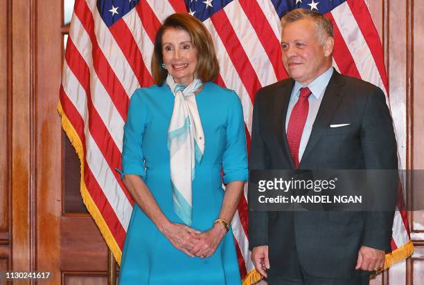 Speaker of the House Nancy Pelosi poses with Jordan's King Abdullah ahead of a meeting at the US Capitol in Washington, DC on March 13, 2019.