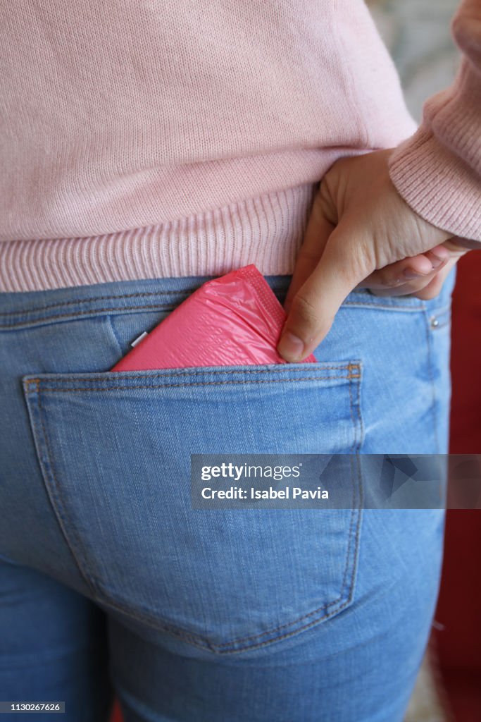Woman Taking Sanitary Pad