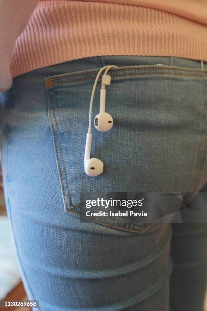 headphones in jeans pocket - phone in back pocket stock pictures, royalty-free photos & images