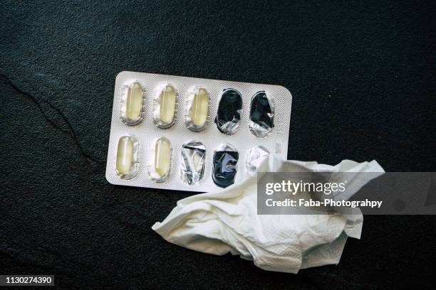 tissues and pills - papiertaschentuch stock pictures, royalty-free photos & images