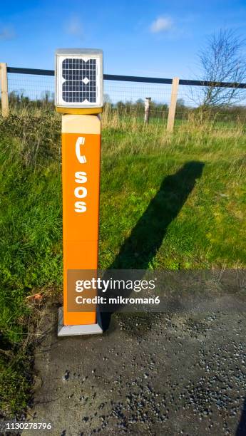 sos emergency road telephone box - emergency telephone box stock pictures, royalty-free photos & images