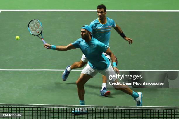 Jean-Julien Rojer of the Netherlands and Horia Tecau of Romania in action against Jeremy Chardy of France and Henri Kontinen of Finland in their...