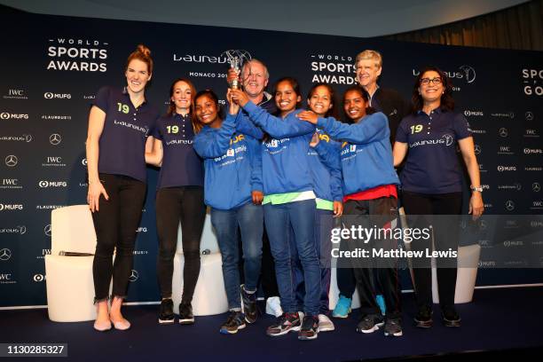 Winners of the Laureus Sport For Good Award Wumu Football team,a football based indian charity pose with their trophy with Laureus Academy Member...