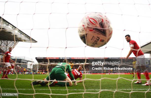 Goalkeeper Frank Fielding and Tomas Kalas of Bristol City fails to stop Ivan Cavaleiro of Wolverhampton Wanderers from scoring his team's first goal...