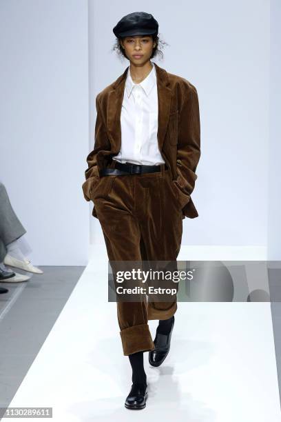 Model walks the runway at the Margaret Howell show during London Fashion Week February 2019 on February 17, 2019 in London, England.