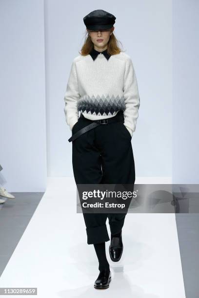 Model walks the runway at the Margaret Howell show during London Fashion Week February 2019 on February 17, 2019 in London, England.