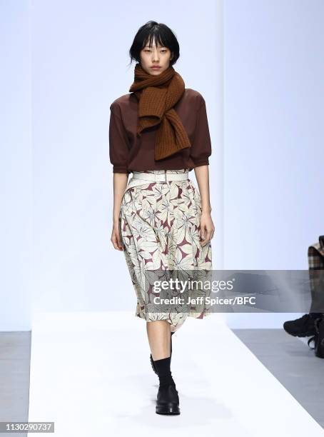 Model walks the runway at the Margaret Howell show during London Fashion Week February 2019 on February 17, 2019 in London, England.