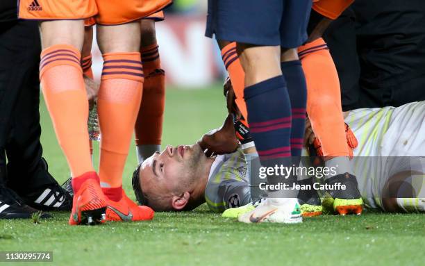 Goalkeeper of Lyon Anthony Lopes is injured after being hit by Philippe Coutinho of Barcelona during the UEFA Champions League Round of 16 Second Leg...