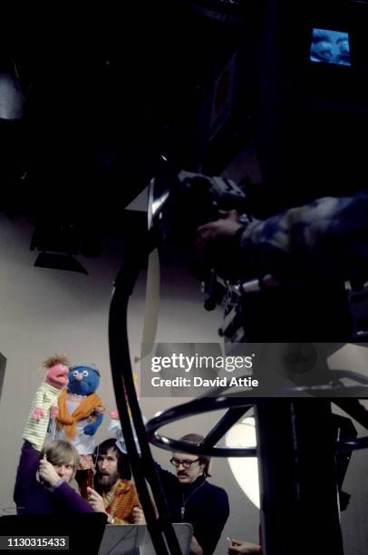 Puppeteers Daniel Seagren holding Roosevelt Franklin, Jim Henson holding Grandmother Happy, and Frank Oz holding Betty Lou, rehearse for an episode...