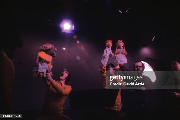 Puppeteers Daniel Seagren holding Grandmother Happy, Jim Henson holding Roosevelt Franklin, and Frank Oz holding Betty Lou, rehearse for an episode...