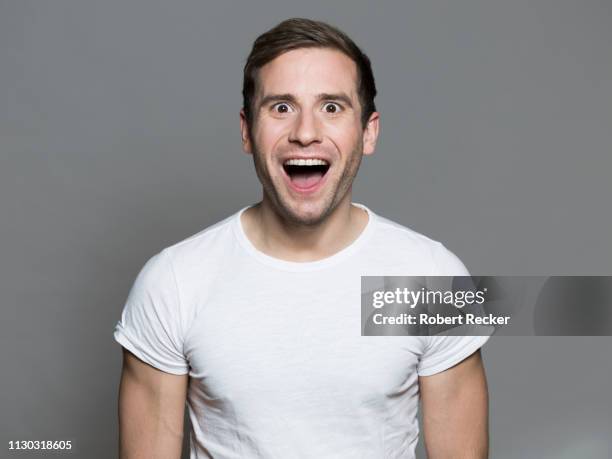 impresed young man - mund stock-fotos und bilder