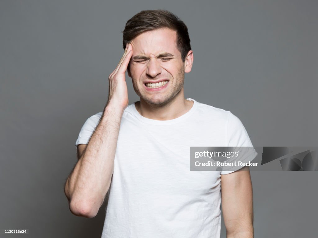 Young man having a headache