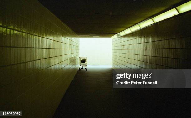 light at the end of the tunnel - abandoned cart stock pictures, royalty-free photos & images