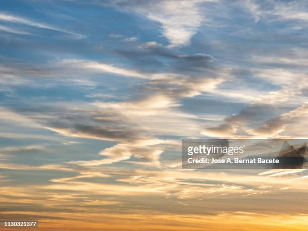 full frame of the low angle view of clouds in sky during sunset. - grey clouds stock pictures, royalty-free photos & images