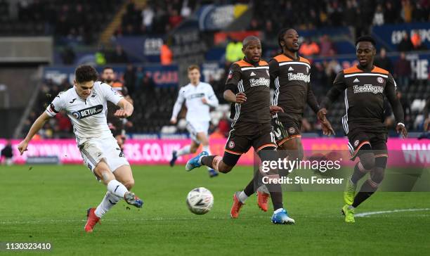 Swansea player Daniel James shoots to score the second Swansea goal after running hlaf the length of the pitch during the FA Cup Fifth Round match...