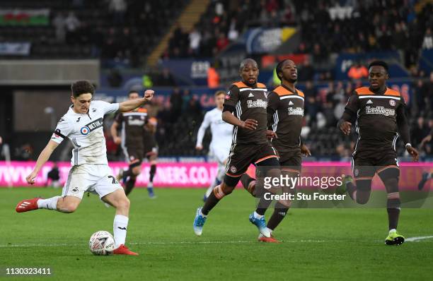 Swansea player Daniel James shoots to score the second Swansea goal after running hlaf the length of the pitch during the FA Cup Fifth Round match...