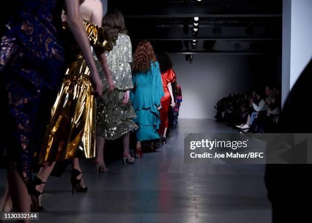 Models walk the runway at the Osman catwalk show during London Fashion Week Festival at the BFC Show Space on February 17, 2019 in London, England.