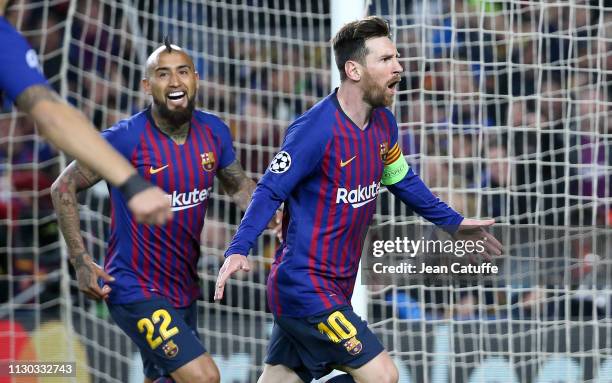 Lionel Messi of Barcelona celebrates his second goal with Arturo Vidal during the UEFA Champions League Round of 16 Second Leg match between FC...