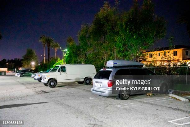 Cars with sleeping veterans in a Safe Park LA parking lot near the Veteran's Affairs Los Angeles Healthcare Center in Los Angeles, California,...