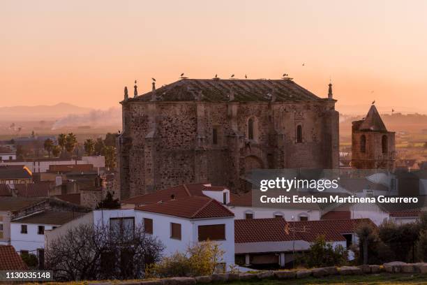 Sunset views of the church of Santa Cecilia and the town of Medellin