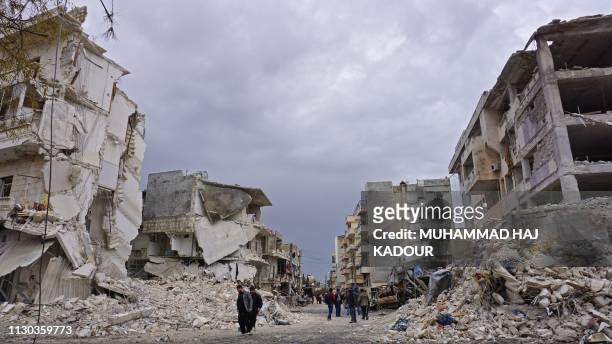 This picture taken on March 14 shows destruction following an airstrike in the jihadist-held city of Idlib, northwestern Syria. Russian air strikes...