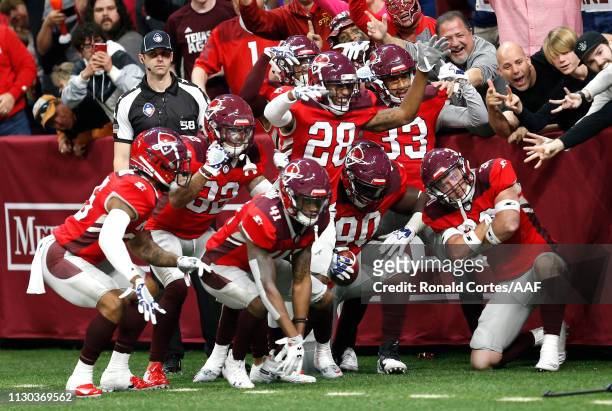 Joey Mbu of the San Antonio Commanders celebrates with teammates after a fumble return touchdown during the third quarter against the Orlando Apollos...