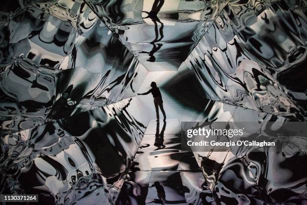 Irish artist Laura Buckley poses inside her installation 'Fata Morgana' during the press preview of 'Kaleidoscope', at the Saatchi Gallery on March...