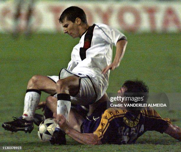 Aravena of the team Deportivo Concepcion de Chile struggles for the ball with Pedrinho of the team Vasco da Gama at Sao Januario Stadium in a...