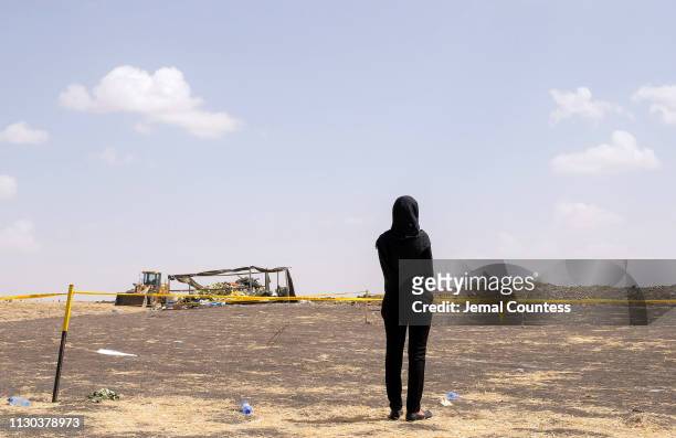 Mourner, believed to be an Ethiopian Airlines cabin crew member, arrives to pay her respects at the crash site of Ethiopian Airlines Flight ET302 on...