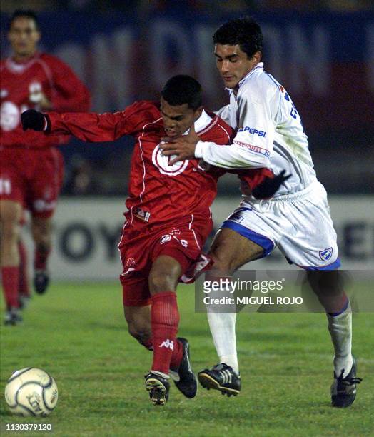 Fabian Coelho player for Nacional fights for the ball with Luis Garcia of America de Cali , 17 May 2001 in Montevideo, Uruguay. Fabian Coelho jugador...