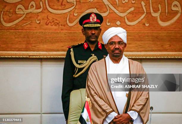 Sudan's President Omar al-Bashir attends a meeting with his new 20-member cabinet as they take oath at the presidential palace in the capital on...