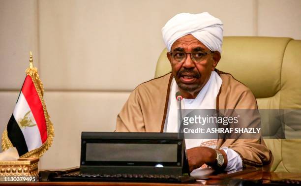 Sudan's President Omar al-Bashir attends a meeting with his new 20-member cabinet as they take oath at the presidential palace in the capital on...