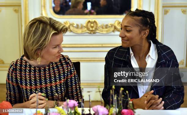 Queen Mathilde of Belgium and Olympic champion Nafi Thiam pictured at a royal meeting with women from different fields in the Liege province, Tuesday...