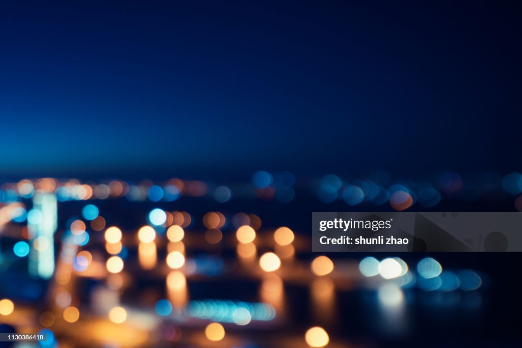 Street lights of urban city street at night