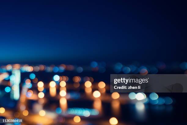 street lights of urban city street at night - illuminated building stock pictures, royalty-free photos & images