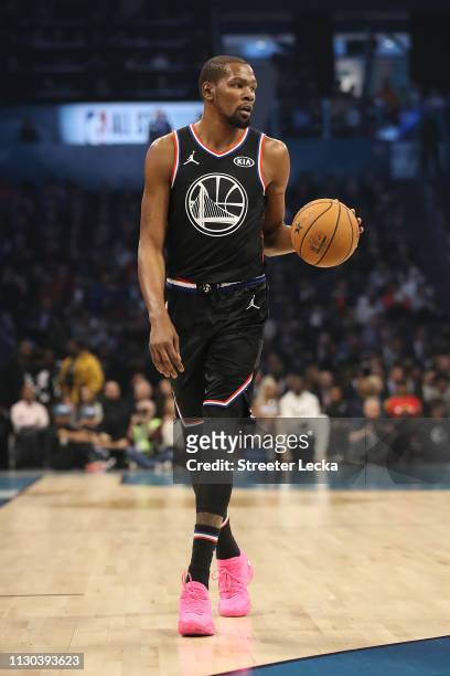 Kevin Durant of the Golden State Warriors and Team LeBron looks to pass against Team Giannis in the first quarter during the NBA All-Star game as...