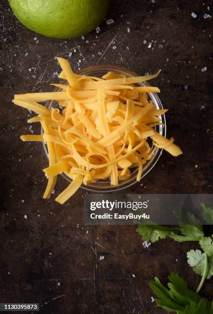 grated cheddar cheese - cheddar cheese stock pictures, royalty-free photos & images