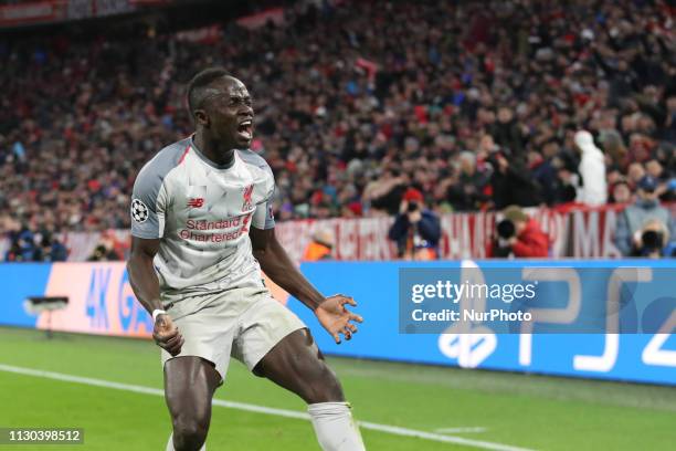 Liverpool's Senegalese striker Sadio Mane celebrates scoring the opening goal during the UEFA Champions League, last 16, second leg football match...