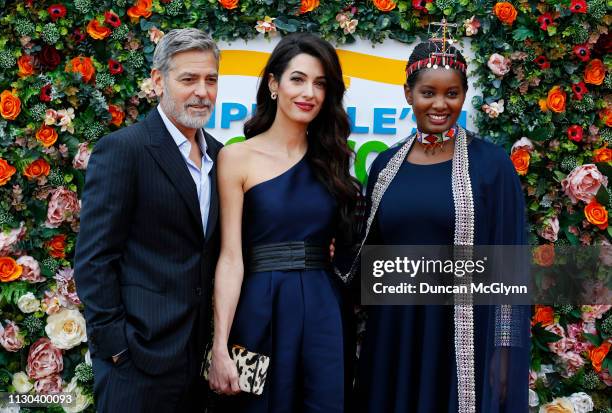 George and Amal Clooney and human rights activist Nice Nailantei Leng'ete attend the People’s Postcode Lottery Charity Gala at McEwan Hall on March...